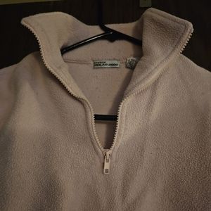 Women's pink sweater with long sleeves.